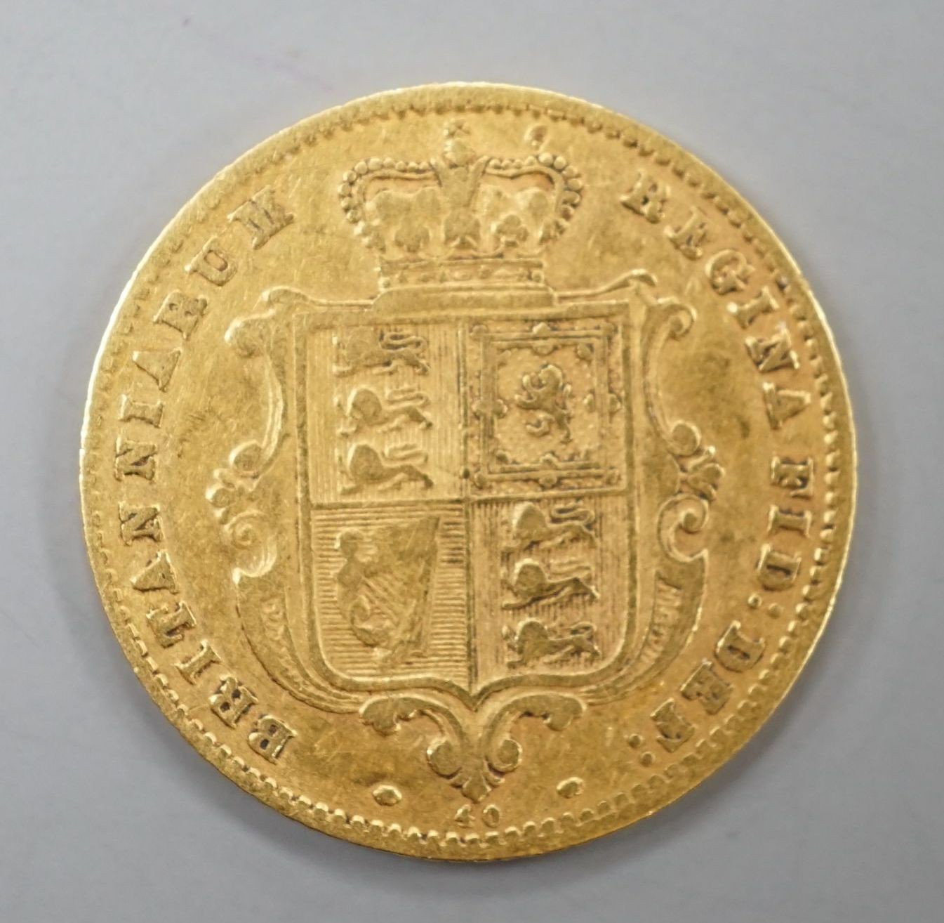 A Victorian 1871 gold shield back half sovereign, London Mint.